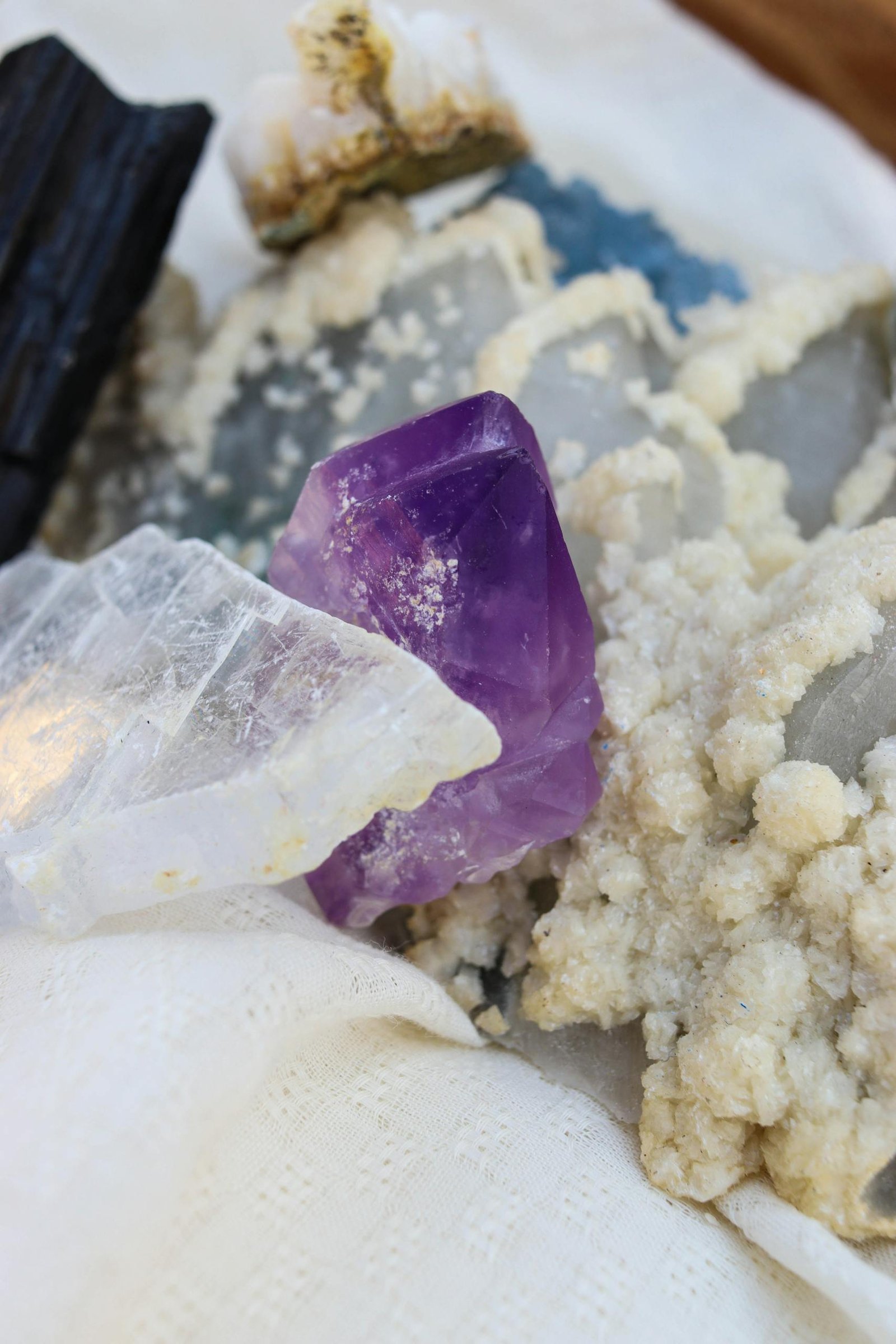 A visually captivating assortment of colorful crystals and minerals. Ideal for nature and science enthusiasts.